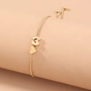 Gold tone adjustable box chain bracelet featuring a charming pendant and cute heart detail.