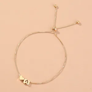 Close-up detail of the elegant gold box chain bracelet featuring an adjustable sliding bead.