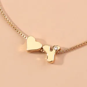 Gold box chain bracelet featuring a heart pendant and a sparkling letter Y charm for daily wear.