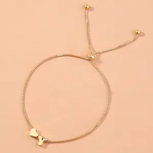 Gold box chain slider bracelet featuring a heart charm and sparkling letter Y pendant detail.