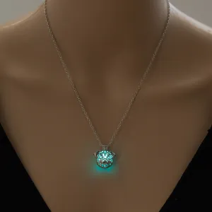 Detailed shot of a glowing dog pendant necklace, luminous hollow design, elegant silver chain.