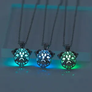 Glow in dark pug dog pendant necklace detail, featuring hollow metal animal luminous effect.