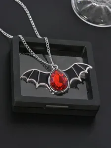 Gothic vampire bat wing pendant necklace featuring a striking red teardrop gemstone detail.