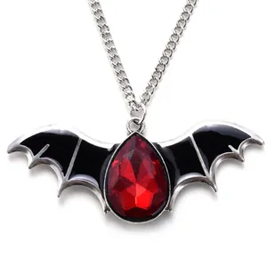 Gothic vampire bat wing necklace with red teardrop gem, punk style Halloween jewelry gift.