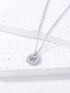 Close-up detail of the minimalist silver stainless steel letter W pendant necklace.