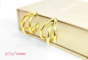 Gold multi-layer hoop earrings for women, stylish hollow round tube minimalist jewelry.