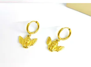 Stainless steel gold-plated angel hoop earrings detail, minimalist fashion jewelry design.