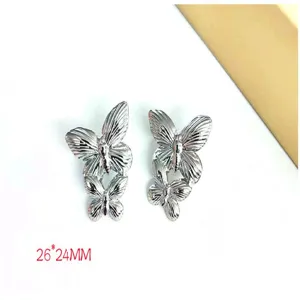 Stainless steel butterfly earrings detail view, double layer butterfly design, 26x24mm size.