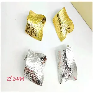Detailed view of fashionable metallic wavy earrings set in gold and silver finish, 23x24mm size.