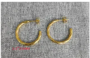 Detail view of 18k gold plated stainless steel twisted hoop earrings, elegant minimalist design.