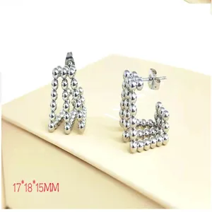 Stainless steel multi-row ball earrings detailed view, modern geometric silver hoop jewelry.