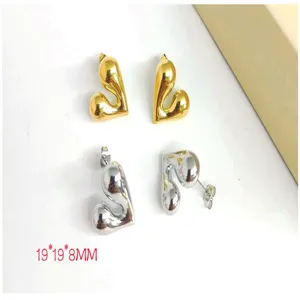 Detailed view of chunky abstract heart earrings in gold and silver finish, 19mm size.