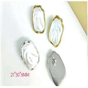 Detailed view of irregular metal and pearl texture earrings, showcasing front and back.