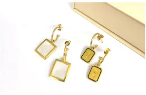 Trendy 18K gold stainless steel shell and engraved rectangular drop earrings detail showcase.