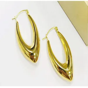 Detailed view of fashionable 18k gold plated stainless steel v-shaped hoop earrings design.