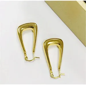 Stainless steel gold U-shaped earrings mirror polish delicate fashion jewelry detail view