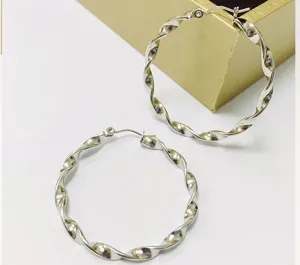 Stainless steel twisted hoop earrings detail, silver geometric water wave ear accessory.