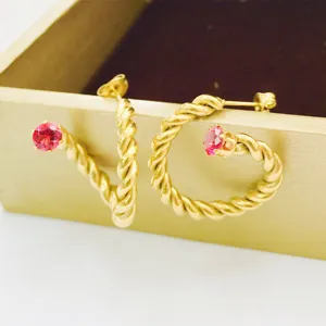 Gold twisted rope earrings with red cubic zirconia, stylish stainless steel jewelry for women.