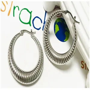 Stainless steel crescent textured hoop earrings for women fashion jewelry accessory.