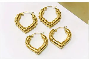 Gold plated stainless steel heart hoop earrings with stylish retro ribbed bamboo design.