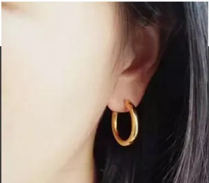 Trendy chunky gold-plated C-shaped hoop earrings for women, stylish minimalist ear jewelry.