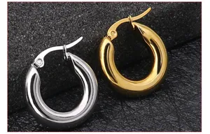 Stainless steel hoop earrings detail shot showcasing silver and gold color options texture.