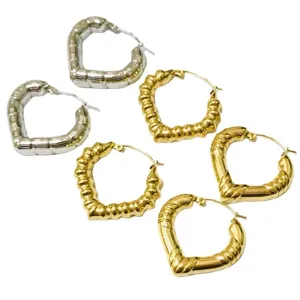 Stainless steel heart bamboo hoop earrings in gold and silver, trendy vintage hollow design.