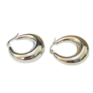 Chunky silver hoop earrings for women, modern thick crescent U shape minimalist jewelry.