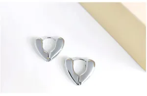 Minimalist silver metal heart hoop earrings, unique geometric chic daily jewelry accessory.