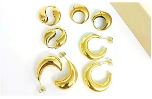Gold plated stainless steel chunky crescent hoop and teardrop earrings detail display.