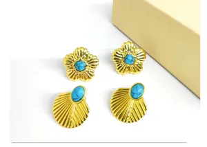 Detail shot of vintage gold-plated flower and shell earrings with turquoise stone inlay.
