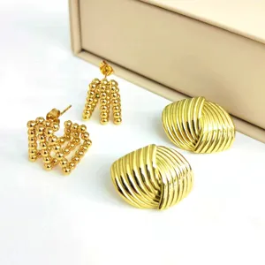Gold stainless steel statement earrings set, chunky beaded hoops and ribbed dome studs.