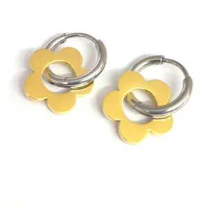 Trendy stainless steel hoop earrings with gold flower pendant for women fashion daily wear.