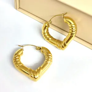 Chunky gold heart hoop earrings for women, stylish stainless steel C-shaped bamboo jewelry.