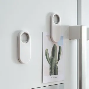 Magnetic refrigerator bottle opener white capsule shaped beer bottle cap opener for kitchen.