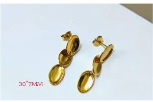 Close-up detail of 18k gold plated stainless steel triple oval dangling earrings design.