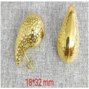 Gold-plated stainless steel textured teardrop earrings detail view, stylish fashion jewelry.