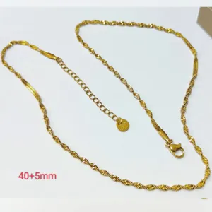 Gold stainless steel twist collarbone chain necklace with extension for modern women fashion.