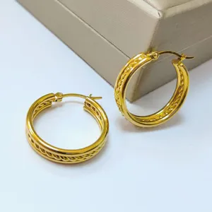 Stainless steel twisted gold hoop earrings, elegant 18K gold plated minimalist jewelry design.