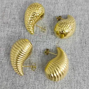 Chunky gold-plated stainless steel water drop earrings with hammered and ribbed textures.