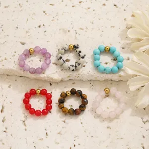 Natural stone beaded ring detail shot showcasing multi-color gemstone beads and metallic accent.