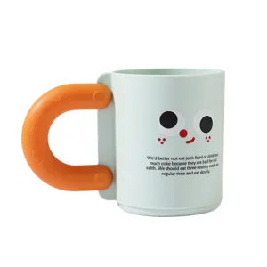 Cute plastic toothbrush cup featuring a cartoon face and orange handle for home use.