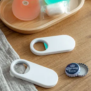 Magnetic bottle opener for refrigerator, white minimalist capsule design beer cap opener for home.