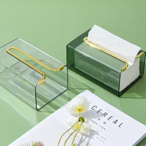 Transparante groene plastic tissuebox met gouden metalen stang moderne inrichting