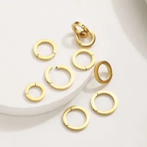Detail view of gold stainless steel spring open clasps, perfect for DIY jewelry connecting parts.