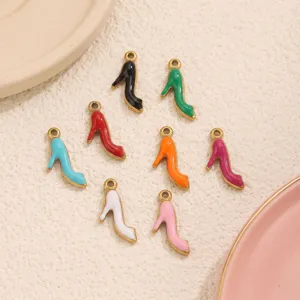 Close-up detail of colorful enamel high heel shoe charms, perfect for DIY jewelry making.
