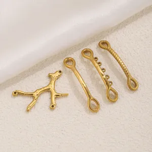 Close-up view of gold plated stainless steel DIY jewelry connectors and branch charms.