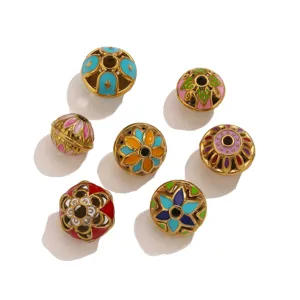 Detailed close-up shot of colorful enamel hollow flower spacer beads for DIY jewelry.