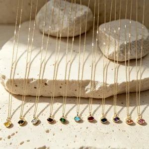 Detailed close-up view of vintage colorful gemstone marquise pendant gold necklaces.