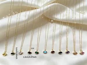 Detailed view of colorful marquise pendant necklaces set, elegant gold chain jewelry.